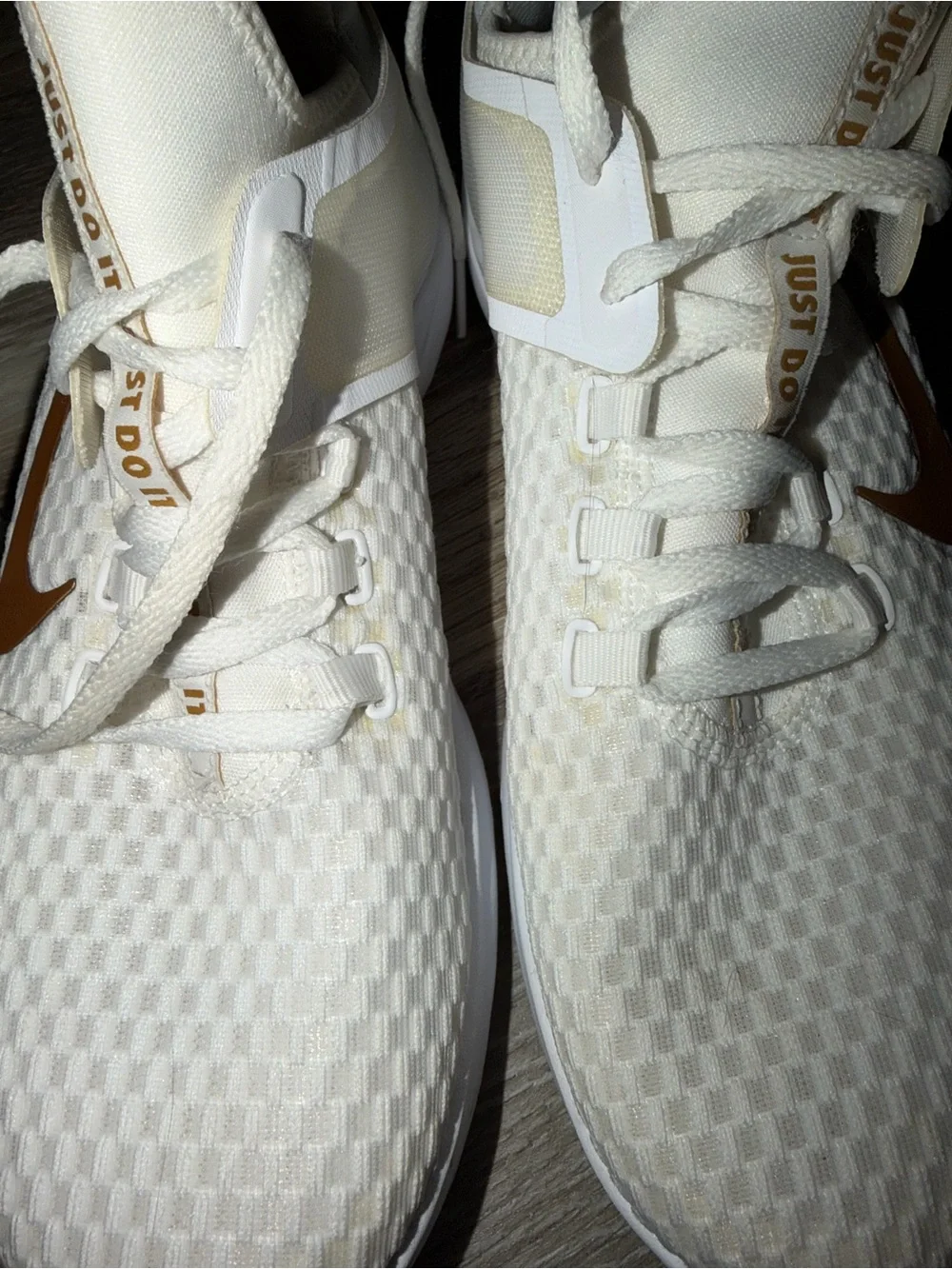 Nike Women's White Athletic Sneakers with Gold Swoosh